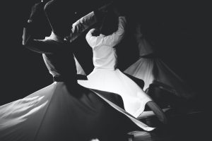 three person dancing dervish dance